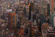 © VICTOR TORRES/Stocksy - Aerial view of NYC skyline with illuminated buildings at dusk