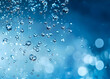 © marin - Water drops on a blue background a realistic photo of water bubbles in the air with an underwater effect Water droplets bubbles and blurs in an ocean or sea for design.j