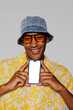 © BONNINSTUDIO/Stocksy - Stylish man showing smartphone with blank screen