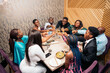 © Santi Nuñez/Stocksy - A family Toasting at a Celebration Dinner