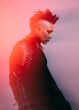 © VICTOR TORRES/Stocksy - Artistic portrait of a man with edgy fashion and bright lighting