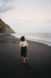 © Lucas Ottone/Stocksy - Analog snapshot moment of woman in sandy beach