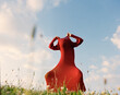 © Ulas&Merve/Stocksy - Surreal Artistic Photo of Figure in Red Dress in Meadow