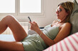 © Guille Faingold/Stocksy - Morning Relaxation With Smartphone at home