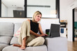 © Guille Faingold/Stocksy - BusinessWoman Using tablet fro video call working from home
