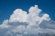 © Sonja Lekovic/Stocksy - Fluffy white clouds and blue sky background