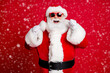 © deagreez - Portrait of his he nice handsome cheerful cheery lucky bearded Santa father having fun celebrating season sale fairy christmastime isolated bright vivid shine vibrant red color background