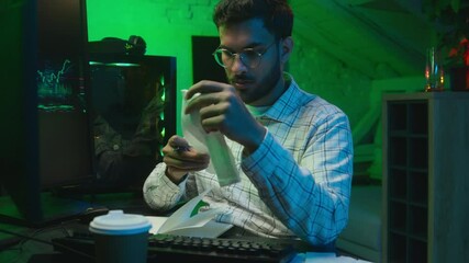 Arabian Indian man male guy programmer examining writing binary code coder freelancer engineer worker IT specialist monitor analyzing computer ecommerce office business hacker businessman Bitcoin web
