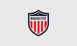© anissa - Shield emblem with 'Manchester' and red stripes.