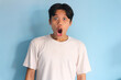 © Muhamad  - Shocked face of Asian young man in white t-shirt on a isolated background
