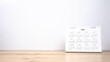© MAITREE - Calendar year 2025 schedule on wood table white background.2025 calendar planning appointment meeting concept. copy space.