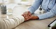 © peopleimages.com - Advice, doctor and patient holding hands in office for care, kindness and help at clinic consultation. Support, comfort and medical advisor with person for empathy, counseling or hospital healthcare