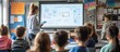 © Almahyra - Teacher presenting a lesson to a group of children in a classroom using a digital whiteboard and tablet.