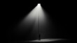 © INT888 - solitary figure stands under streetlight, surrounded by darkness, creating dramatic contrast of light and shadow. scene evokes feelings of isolation and contemplation