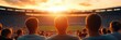 © mangolovemom - A group of spectators watching a sunset at a stadium, capturing the vibrant atmosphere and anticipation of a live sports event.