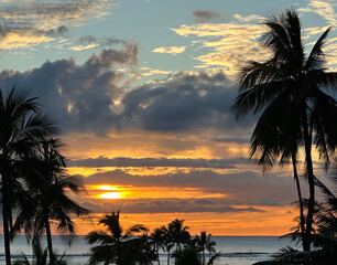 a typical sunset in oahu honolulu, which is always stunning! yellows, oranges, navy blues, clouds, o