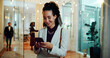 © peopleimages.com - Business, phone and woman in hotel lobby with typing, connection and online review for accommodation. Smartphone, hospitality and businesswoman with smile, search and mobile app for travel booking