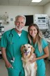 © Papukos - Veterinarians posing with golden retriever dog in clinic