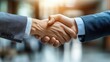 © Phoenix AI Photo - Two colleagues shaking hands in a bright, modern office lobby, formal suits, natural sunlight streaming in, successful business deal, sleek corporate branding background