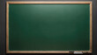 © Miklos - A green chalkboard with a wooden frame is completely empty except for a small pattern of dots in the corner