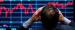 © NATTAWUT - A distressed trader analyzes a stock market chart showing a downward trend, reflecting concerns over financial losses and market volatility.