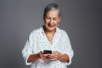 studio, senior woman and smile with smartphone for communication, chat and online with contact. mock
