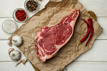 Wall Mural - Raw beef meat on a light table. Fresh raw meat