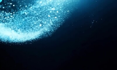 Wall Mural - sparkling particles and blue glowing bokeh lights against a dark background. create a magical, festi