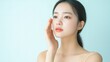 © mediavn - Beauty portraits of beautiful young Asian woman caring her face with cream. Skin care concept