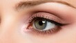 © KKC Studio - Close-Up Shot of a Woman's Eye with Beautiful Makeup Featuring Soft Pink Eyeshadow and Dramatic Eyeliner Highlighting Natural Beauty