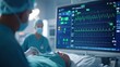 © BussarinK - A healthcare professional monitors a patient's vital signs on a digital screen in a hospital setting.