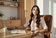 © Antonio Solano - Enterprising woman managing business from home office using laptop