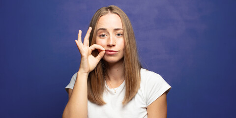 Canvas Print - looking serious and displeased with both fingers crossed up front in rejection, asking for silence