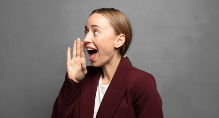 Wall Mural - profile view, looking happy and excited, shouting and calling to copy space on the side