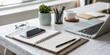 © Man888 - Aerial Perspective of a Sleek Modern Workspace Featuring a Smartphone, Notepad, and Stylish Desk Accessories for Enhanced Productivity and Creativity