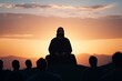 © fotogurmespb - Silhouette of Jesus at sunset speaking to captivated audience; use warm palette