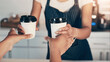 © peopleimages.com - Hands, customer and coffee service with barista for order, sale and pov of people. Cafe closeup, waitress and giving drink, takeaway and client purchase latte for hospitality offer in small business