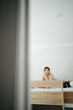 © Austockphoto - Young boy sitting on top of the bunk bed.