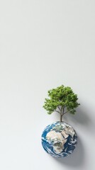 A tree is growing on top of a globe