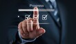 © BusTech - Businessman or manager touching on checklist to tick correct mark with progressive loading status to remind work task progressive for project develop management and tracking concept.