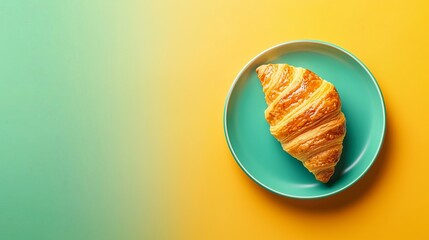 A delicious, flaky croissant resting on a teal plate against a vibrant gradient backdrop.