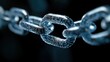 © Iona - A close-up of a metallic chain link reflecting blue light, symbolizing strength and connection in an abstract digital environment.