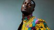 © Thavesak - Pride in Every Stitch: Confident Black Man in Dynamic Cultural Attire on Magazine Cover