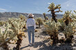 © Julija - woman visiting Joshua Tree National park, enjoy Cholla cactus garden.