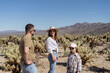 © Julija - Family in Joshua tree National Park, Cholla cactus garden. USA, California.