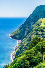 Wall Mural - A view towards the beach at Lombo Gordo from the viewpoint at Sossego on the island of Sao Miguel in the Azores in summertime