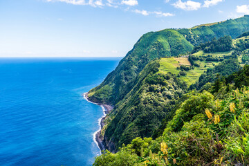 Wall Mural - A view south of coastal scenery from the viewpoint at Sossego on the island of Sao Miguel in the Azores in summertime