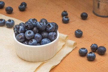 Bowl of ripe blueberries close-up on the table