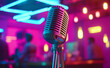 © Curioso.Photography - Vintage microphone in a vibrant neon-lit bar setting, suggesting live music or stand-up comedy performance ambiance.
