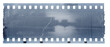 © Simon - A single blue film strip with a white border and a light gray background. The film has visible grain, as if it's an old photograph or video clip. There is some wear on the edges of each frame side.